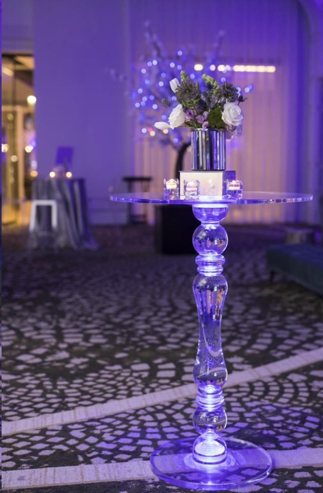 30" clear acrylic highboy cocktail table with a floral centerpiece set up for an event reception in Atlanta, Georgia